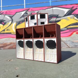 Red Oak Sound System Mini Replica with Bluetooth and rechargeable battery, against an urban graffiti backdrop.