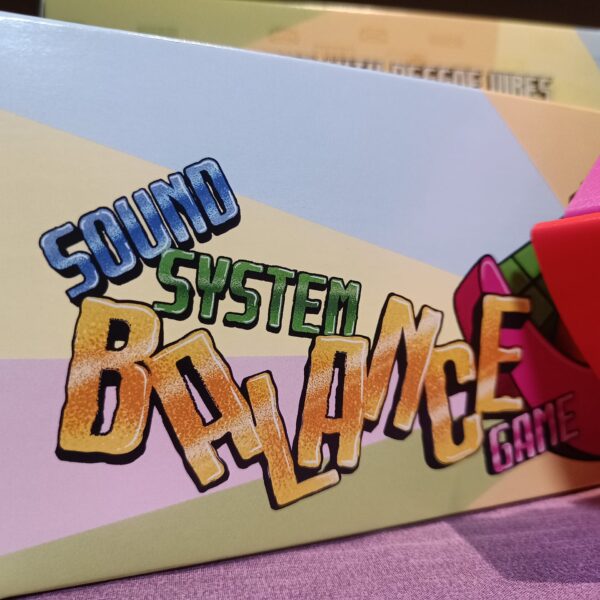 Close-up of the Sound System Balance Game box with the tagline 'A Board Game with Reggae Vibes' displayed.